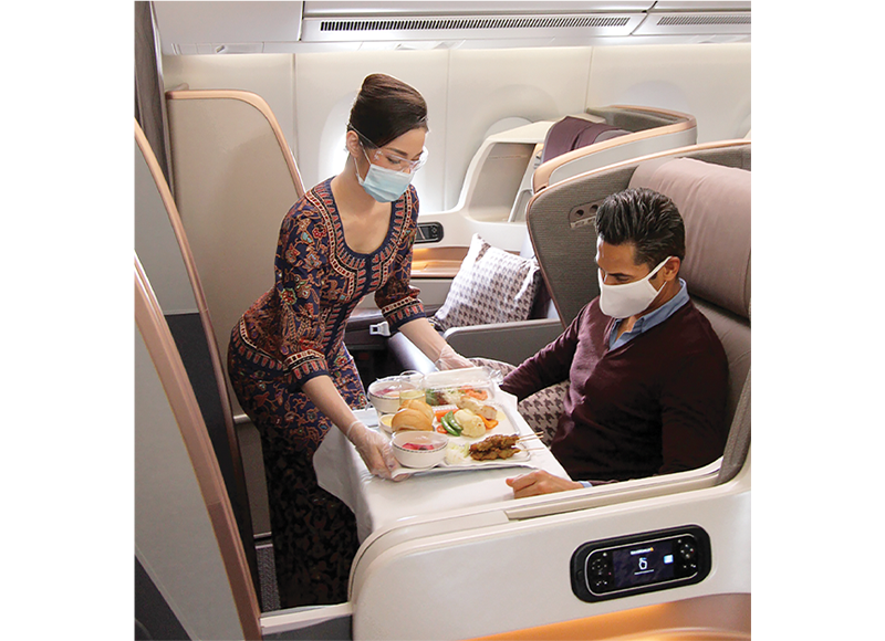 Business Class tray service in an A350. At the peak of the Covid-19 pandemic, all cabin crew were required to wear goggles and masks. But goggles are no longer necessary today. Courtesy of Singapore Airlines.